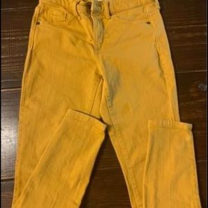 Women’s jeans in a mustard color